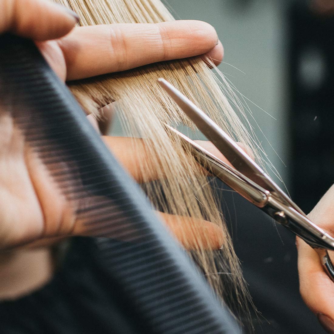 girl-getting-hair-cut-scissors